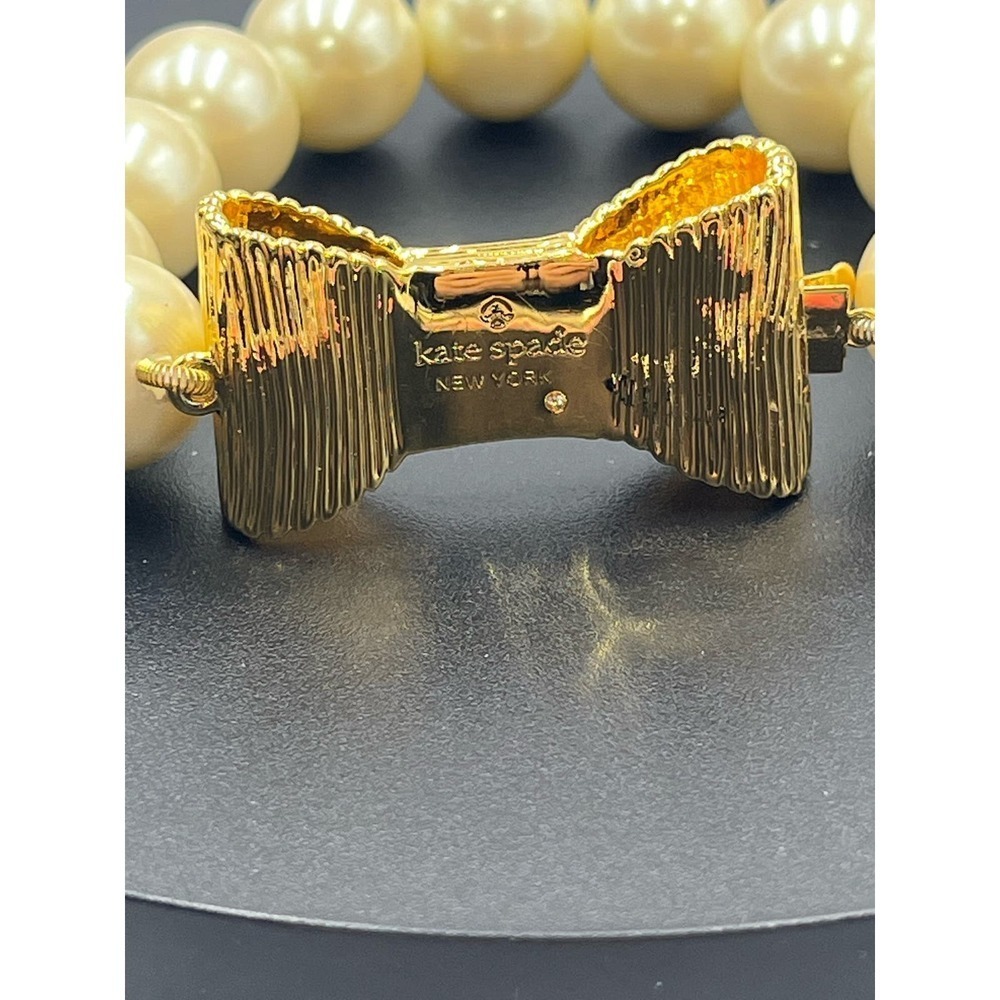 Kate Spade All Wrapped Up Pearl Gold Bow Bracelet - Picture 7 of 13